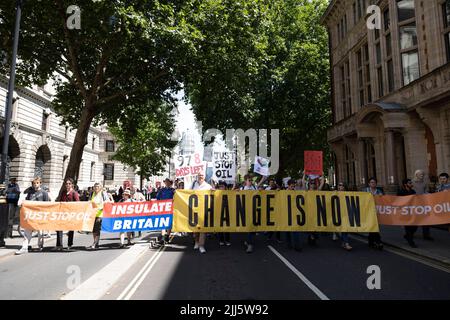 London, UK. 23rd July, 2022. Protesters hold banners while marching to Parliament Square. Multiple climate activists groups, including Just Stop Oil, Insulate Britain and Extinction Rebellion, marched from several locations in central London to Parliament Square to demand the UK government to stop investing on new fossil fuel to tackle climate changes. Credit: SOPA Images Limited/Alamy Live News Stock Photo