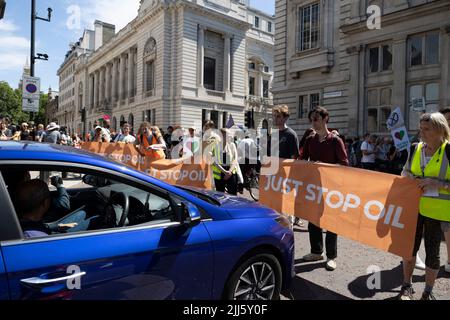 Protesters are seen holding banners to stop the traffic during the demonstration. Multiple climate activists groups, including Just Stop Oil, Insulate Britain and Extinction Rebellion, marched from several locations in central London to Parliament Square to demand the UK government to stop investing on new fossil fuel to tackle climate changes. (Photo by Hesther Ng / SOPA Images/Sipa USA) Stock Photo