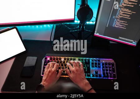 Hand's of man working on desktop PC Stock Photo