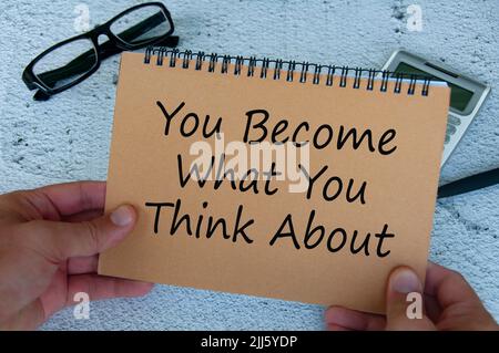 You become what you think about text written on brown notepad. Motivational and inspirational concept. Stock Photo