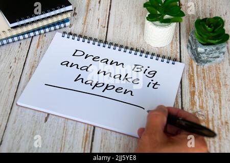 Dream big and make it happen text written on notepad. Motivational and inspirational concept. Stock Photo