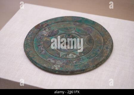 Ancient Chinese Han Dynasty cultural relics in the museum, bronze mirror Stock Photo