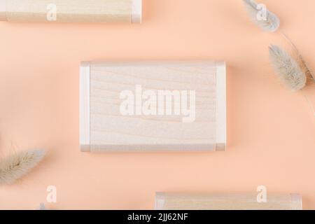 Wooden Box mockup of wooden USB flash drive key storage for computer on apricot or light terracotta background, close up Stock Photo