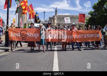 London, England, UK. 23rd July, 2022. Protesters hold Just Stop Oil banners in Parliament Square. Protesters from Just Stop Oil, Extinction Rebellion, Insulate Britain and other groups staged a march through central London calling on the government to end fossil fuels, tax big polluters and billionaires, provide insulation for all homes, and act on the climate and cost of living crises. (Credit Image: © Vuk Valcic/ZUMA Press Wire) Stock Photo