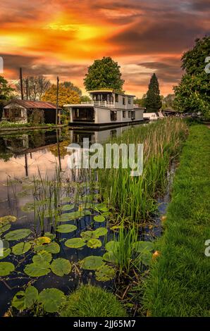 The Erewash canal enters the River Trent at Trent Lock in Nottinghamshire. There are many wonderful house boats moored on the canal, a majestic sight Stock Photo