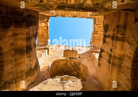 Looking up inside the ruins of the immense Roman amphitheatre in El Jem, Tunisia. Stock Photo