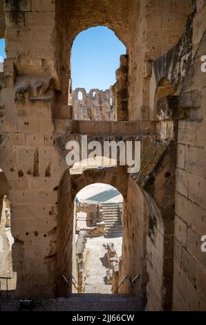 Looking through the ruins of the immense Roman amphitheatre in El Jem, Tunisia. Stock Photo