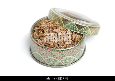 Stack of Dill seeds isolated on white background. Stock Photo
