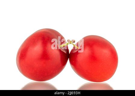 Two organic juicy cherry plums, close-up, isolated on a white background. Stock Photo