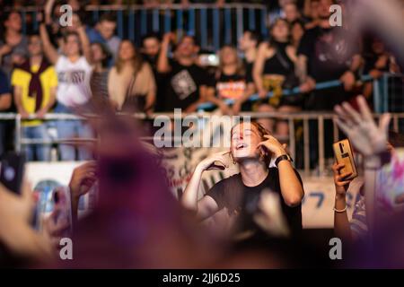 Fans and the crowd enjoy 'No te va a gustar' perform. Stock Photo