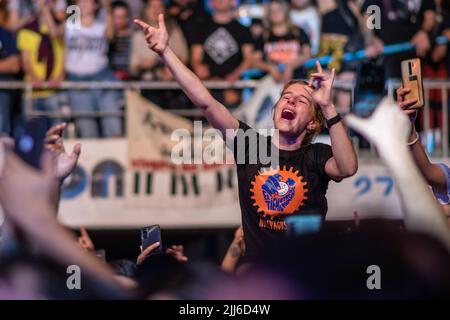 Fans and the crowd enjoy 'No te va a gustar' perform. Stock Photo