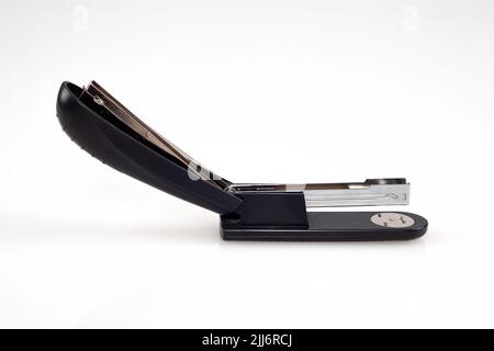 Black office stapler isolated on white background. Stock Photo