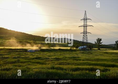 A mesmerizing view of a golden sunset over mountains Stock Photo