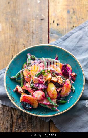 Potato, roast beetroots, green beans and salmon salad Stock Photo