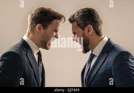 disagreed men business partners or colleague disputing aggressive and angry while conflict, rivalry Stock Photo