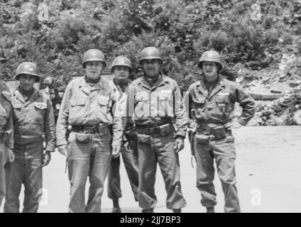 United States Army Troups during the Korean War - Circa 1952. A groupd of diginataries visit the camp. From the collection of Henry G. Shebley Stock Photo