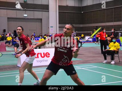 July 23rd, 2022. Khemanit Jamikorn, (playing badminton at left) usually known as 'Pancake' (Thai: เขมนิจ จามิกรณ์),  is a Thai TV actress, singer and model. She won Thai Supermodel Contest 2004 and later won Model of the World 2004 in China. Her husband plays beside her on the right. The event is the table tennis and badminton sports event 'BBG Princess Cup 2022' where participants compete to win the trophy of Her Royal Highness Princess Maha Chakri Sirindhorn at Royal Paragon Hall, Siam Paragon Shopping Center, Bangkok, Thailand, Asia. Stock Photo