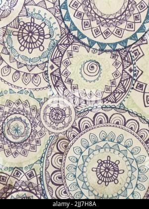 Colorful bohemian hand drawn mandala pattern on textured paper Stock Photo