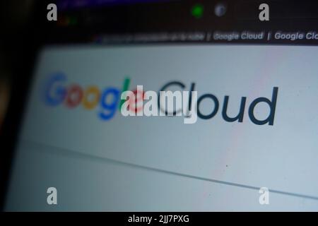 A high-definition close-up of a laptop screen displaying the Google Cloud logo and its cloud computing console interface. This editorial image illustr Stock Photo