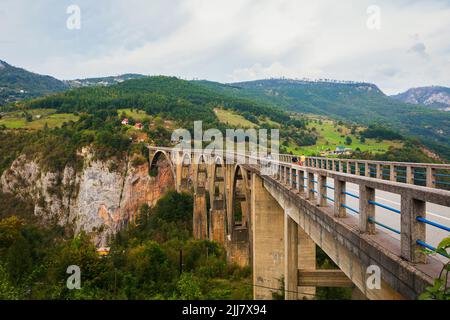 Concrete arch bridge Durdevitsa-Tara across the Tara deep river canyon, Montenegro. Stock Photo