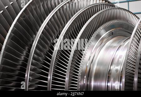 A powerful steam turbine rotor is installed in the lodgment of the steam turbine base. Stock Photo