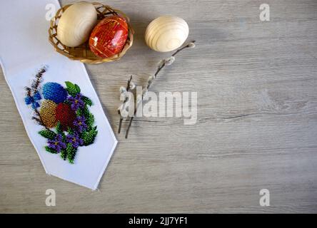 Happy Easter congratulatory background with copy space. Easter beaded stitches on flag with copy space top view Stock Photo