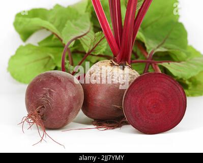 Fresh beetroots with leaves, Beta vulgaris, isolated on white background, healthy organic root vegetable with lots of vitamins and minerals Stock Photo
