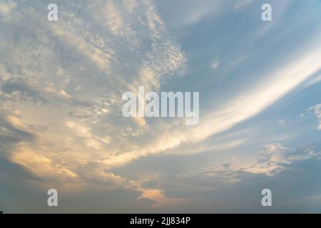 Beautiful clouds on blue sky and orange sunset Stock Photo
