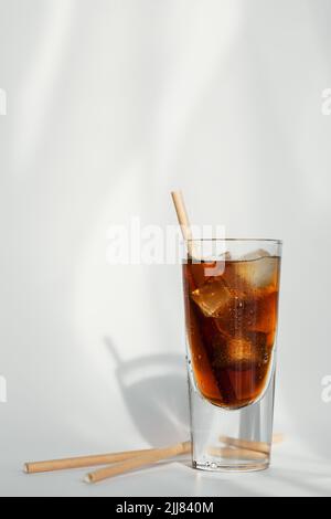 Glass of cola with ice and straw on a white background Stock Photo - Alamy