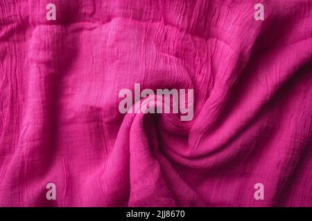 Fabric texture background of pink color. Close up of clothes as wallpaper. Stock Photo