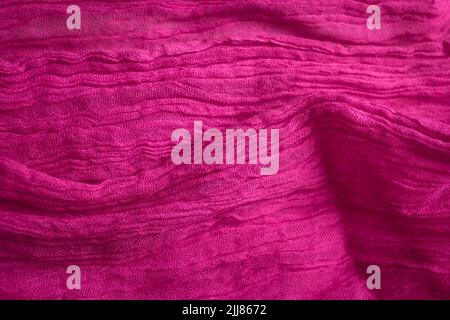 Fabric texture background of pink color. Close up of clothes as wallpaper. Stock Photo