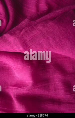 Fabric texture background of pink color. Close up of clothes as wallpaper. Stock Photo