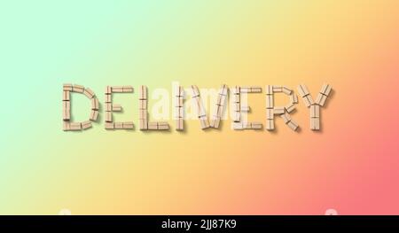 Word DELIVERY from cardboard boxes on color background. Stock Photo