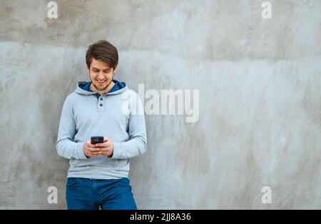 Young man writing sms Stock Photo
