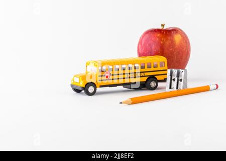 Various items for back to school against a bright white background. Stock Photo