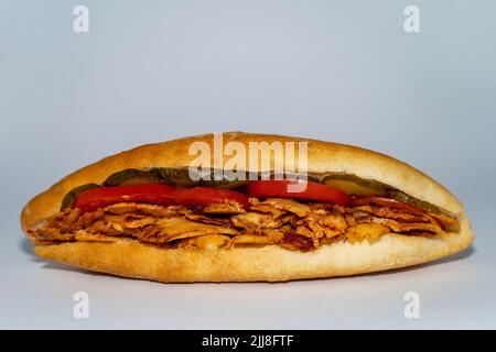 Long Döner chicken sandwich or Sandviç döner Isoläted on white background. Stock Photo