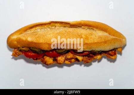 Long Döner chicken sandwich or Sandviç döner Isoläted on white background. Stock Photo