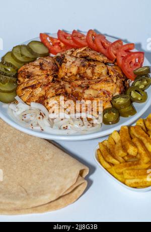 Chicken doner plate in a Restaurant. Isolated. Stock Photo