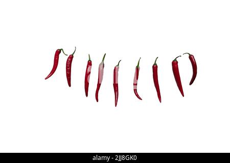 Red fresh chili pepper isolated on white background. Seasoning for dish, hot pepper, spicy spices for cooking, cayenne pepper, food. Set of peppers of Stock Photo