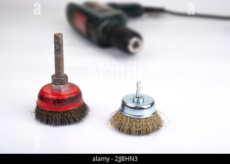 Metal wire brush for a drill machine on a white Stock Photo