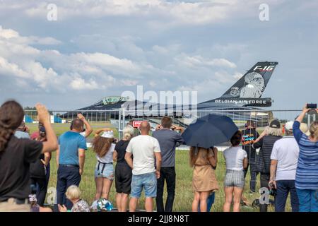 SIAULIAI / LITHUANIA - July 27, 2019: Spectators greeting and waving hands to Belgian air force F-16 fighter jet aircraft taxiing during an air show Stock Photo