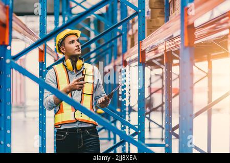 engineer male checking steel metal construction warehouse shelves structure building Stock Photo