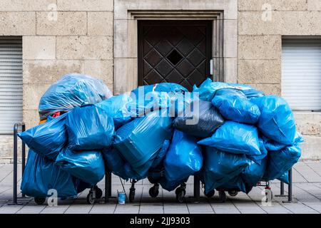 Filled blue pastic bags, waste, rubbish, trash, Münster, Westphalia, North Rhine-Westphalia, Germany Stock Photo