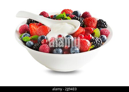 Bowl of healthy fresh berry fruit with cream isolated on white background. Berries colorful assorted mix of strawberry, blueberry, raspberry, blackber Stock Photo