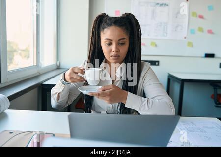 Serious female engineer working in her office Stock Photo