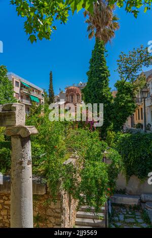 Street view in Plaka district of Athens at the Holy Church of Saint Catherine, vertical Stock Photo