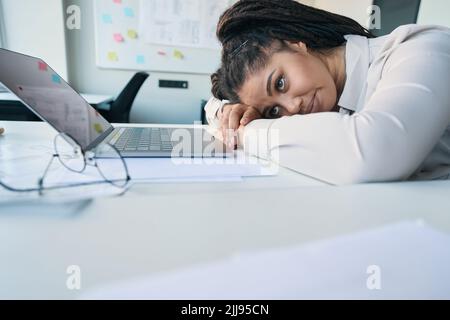Modern company employee suffering from work overload Stock Photo