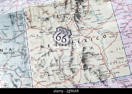 Still-Life Route 66 Shield Pin on a Highway map of Western States, 2022, USA Stock Photo