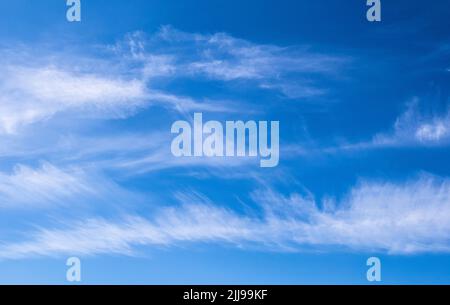 High altitude cirrus clouds in a blue sky - northern Greece Stock Photo