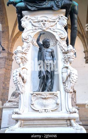 Detail of the plinth of Benvenuto Cellini's statue of Perseus with the Head of Medusai the Loggia dei Lanzi Florence Italy Stock Photo